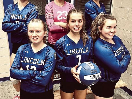 Lincoln Volleyball players celebrate Senior Nigh