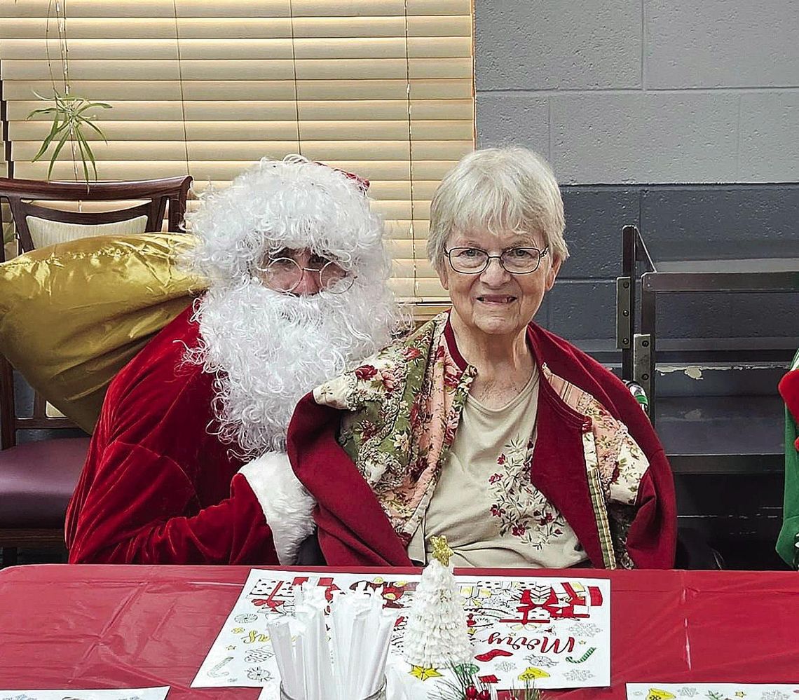 Lincoln Park Manor residents received a special visit from Santa and one of his favorite elves at their Christmas par ty held December 20. Here, Donna Kingan visits with Santa. (Photo courtesy of Lincoln Park Manor)